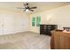 Neutral bedroom features large windows, large closet, and a crib with view of the room at 114 Oxpens Rd, Cary, NC 27513
