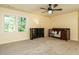 Spacious, neutral bedroom includes a window, ceiling fan and a bed with crib at 114 Oxpens Rd, Cary, NC 27513
