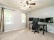 Calm bedroom with a cool color scheme, two large windows, and a great setup for gaming at 114 Oxpens Rd, Cary, NC 27513