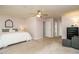 Spacious bedroom with carpet flooring, a ceiling fan, and a large bed at 114 Oxpens Rd, Cary, NC 27513
