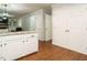 Open kitchen view with granite countertops, white cabinets, and stainless steel appliances at 114 Oxpens Rd, Cary, NC 27513