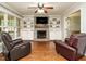 Cozy living room with fireplace, built-in shelving, and comfortable seating at 114 Oxpens Rd, Cary, NC 27513