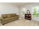 Comfortable living room features two windows, light gray walls, and neutral carpet at 114 Oxpens Rd, Cary, NC 27513