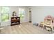Bright living room featuring two windows, light gray walls, and neutral carpet at 114 Oxpens Rd, Cary, NC 27513