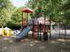 Exterior view of the community playground with slides, climbing features, and a covered picnic area at 114 Oxpens Rd, Cary, NC 27513