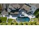 Aerial view of a backyard pool and patio area with a hot tub at 1208 Hunting Ridge Rd, Raleigh, NC 27615