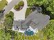 Stunning aerial view of a luxurious home with a beautiful pool, a hot tub, and manicured landscaping at 1208 Hunting Ridge Rd, Raleigh, NC 27615