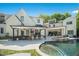 Gorgeous backyard with pool, spa, and outdoor kitchen perfect for entertaining at 1208 Hunting Ridge Rd, Raleigh, NC 27615