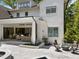 Backyard view showcases a covered patio, fire pit, and beautiful landscaping at 1208 Hunting Ridge Rd, Raleigh, NC 27615