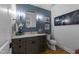 Stylish powder room with painted blue walls, an elegant mirror, and modern vanity at 1208 Hunting Ridge Rd, Raleigh, NC 27615