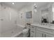 Beautiful bathroom with a frameless glass shower and a white vanity with marble countertop at 1208 Hunting Ridge Rd, Raleigh, NC 27615