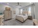 Cozy bedroom with neutral color palette and comfortable furnishings with natural lighting at 1208 Hunting Ridge Rd, Raleigh, NC 27615