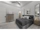 Comfortable bedroom featuring soft carpet, neutral gray tones, and elevated tray ceiling at 1208 Hunting Ridge Rd, Raleigh, NC 27615
