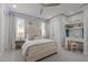 Inviting bedroom with neutral color palette and comfortable furnishings and a built-in desk at 1208 Hunting Ridge Rd, Raleigh, NC 27615