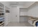 Spacious walk-in closet with custom shelves and ample hanging storage for organization at 1208 Hunting Ridge Rd, Raleigh, NC 27615