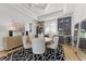Elegant dining room boasts a modern chandelier, bar, and sophisticated decor at 1208 Hunting Ridge Rd, Raleigh, NC 27615