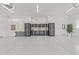 Spacious garage with epoxy flooring and organized storage system at 1208 Hunting Ridge Rd, Raleigh, NC 27615