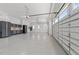 Open garage with an automatic garage door, epoxy flooring, and storage at 1208 Hunting Ridge Rd, Raleigh, NC 27615