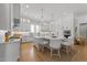 Gourmet kitchen featuring an island with seating, pendant lights, and stainless steel appliances at 1208 Hunting Ridge Rd, Raleigh, NC 27615