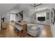 Comfortable living room with sectional seating, built-in entertainment center, and modern ceiling fan at 1208 Hunting Ridge Rd, Raleigh, NC 27615