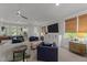Inviting living room with ample seating, large windows, and entertainment center at 1208 Hunting Ridge Rd, Raleigh, NC 27615