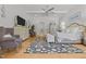 Spacious main bedroom with hardwood floors, seating area, and elegant decor at 1208 Hunting Ridge Rd, Raleigh, NC 27615