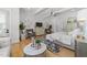 Bright main bedroom showcasing hardwood floors, tray ceiling, and stylish furniture at 1208 Hunting Ridge Rd, Raleigh, NC 27615