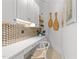 Bright home office with mosaic backsplash, custom cabinetry and shelving with decorative accents at 1208 Hunting Ridge Rd, Raleigh, NC 27615