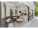 An outdoor kitchen with a bar and cozy seating at 1208 Hunting Ridge Rd, Raleigh, NC 27615