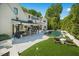 A backyard pool area with an outdoor kitchen, a hot tub, and plenty of lounge space at 1208 Hunting Ridge Rd, Raleigh, NC 27615