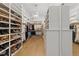 Expansive walk-in closet with custom shelving and ample storage for shoes and clothing at 1208 Hunting Ridge Rd, Raleigh, NC 27615