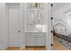 Convenient wet bar area with cabinets, sink, and easy access from the bedroom at 1208 Hunting Ridge Rd, Raleigh, NC 27615