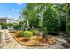 Landscaped backyard area with garden and play area at 12140 Pawleys Mill Cir, Raleigh, NC 27614