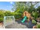Backyard featuring playhouse, slide, and greenhouse at 12140 Pawleys Mill Cir, Raleigh, NC 27614