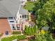 Aerial view of the backyard featuring a covered porch, patio area, and play set at 12140 Pawleys Mill Cir, Raleigh, NC 27614