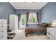 Bright bedroom with a door to the outside and natural light at 12140 Pawleys Mill Cir, Raleigh, NC 27614