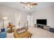 Bright bonus room with a chess set, a tv and a view of the bathroom at 12140 Pawleys Mill Cir, Raleigh, NC 27614