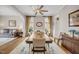 Elegant dining room featuring a large table, hardwood floors, and natural light from surrounding windows at 12140 Pawleys Mill Cir, Raleigh, NC 27614