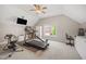 Bright room with vaulted ceilings, equipped with exercise equipment and a workstation at 12140 Pawleys Mill Cir, Raleigh, NC 27614