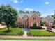 Beautiful two-story brick home with mature landscaping at 12140 Pawleys Mill Cir, Raleigh, NC 27614