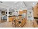 Open kitchen with a large center island, stainless appliances, and an open floor plan at 12140 Pawleys Mill Cir, Raleigh, NC 27614