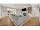 Open living room with hardwood floors, custom built-ins and large windows for natural light at 12140 Pawleys Mill Cir, Raleigh, NC 27614