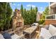 Relaxing outdoor patio with stone fireplace and comfortable seating at 12140 Pawleys Mill Cir, Raleigh, NC 27614