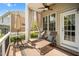 Comfortable patio area with cushioned lounge chairs, and a ceiling fan for outdoor relaxation at 12140 Pawleys Mill Cir, Raleigh, NC 27614