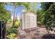 Backyard shed with landscaping and stone path at 12140 Pawleys Mill Cir, Raleigh, NC 27614