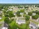 Overhead image of a lovely neighborhood featuring mature trees and lush landscaping and a well-maintained residence at 124 Roscommon Ln, Clayton, NC 27520