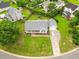 Well-maintained one-story home featuring a charming front porch, driveway, and lush green lawn at 124 Roscommon Ln, Clayton, NC 27520