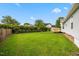Well-manicured backyard with privacy hedges and wooden deck at 124 Roscommon Ln, Clayton, NC 27520