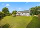 Spacious backyard with healthy grass and wooden deck feature at 124 Roscommon Ln, Clayton, NC 27520