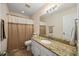 Bathroom featuring granite countertop, white cabinets, and neutral walls at 124 Roscommon Ln, Clayton, NC 27520